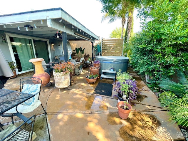 9125 Gleeson Ct, Bakersfield, CA 93311 - view of patio / terrace with a hot tub, outdoor dining area, and a ceiling fan
