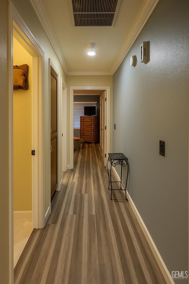 9125 Gleeson Ct, Bakersfield, CA 93311 - corridor with wood finished floors and ornamental molding