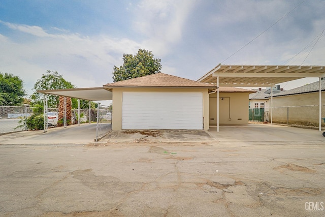 exterior space with a carport, fence, and a garage door opener