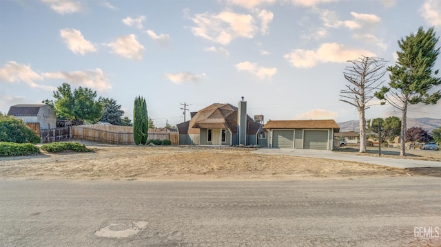 19701 Mesa Dr, Tehachapi, CA 93561 - view of front facade featuring concrete driveway and an attached garage