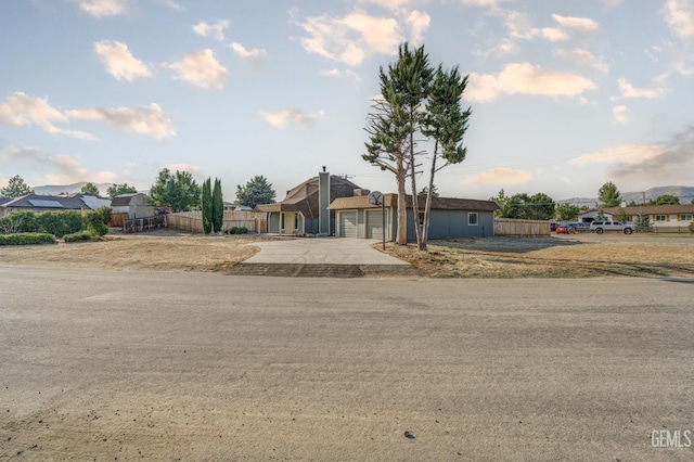 19701 Mesa Dr, Tehachapi, CA 93561 - view of front facade featuring concrete driveway and an attached garage