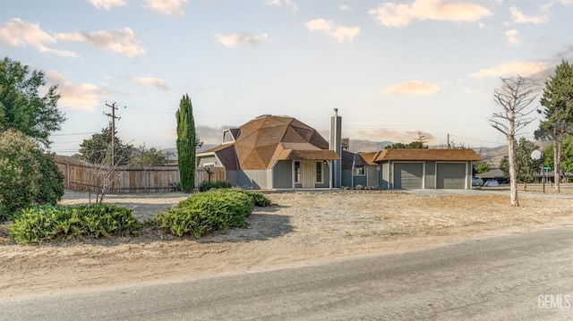 19701 Mesa Dr, Tehachapi, CA 93561 - view of front of property with a garage and a chimney