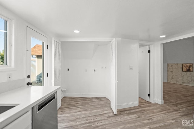 19701 Mesa Dr, Tehachapi, CA 93561 - kitchen with dishwasher, light wood-style floors, light countertops, recessed lighting, and white cabinetry
