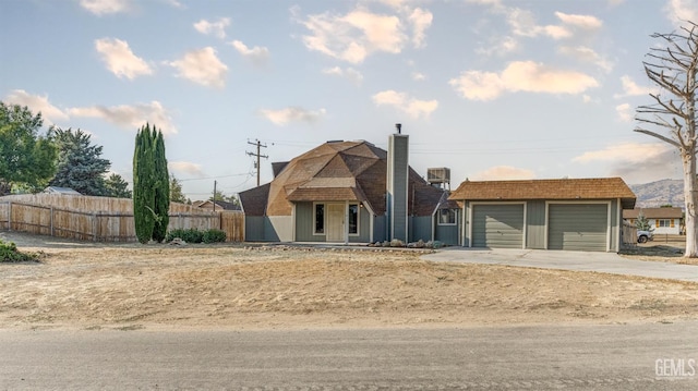 19701 Mesa Dr, Tehachapi, CA 93561 - view of front of house with a garage, a chimney, and concrete driveway