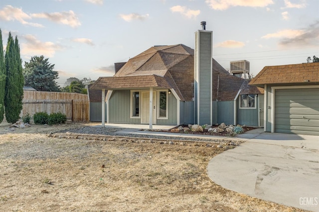 19701 Mesa Dr, Tehachapi, CA 93561 - view of front of property with a chimney, driveway, covered porch, and a garage