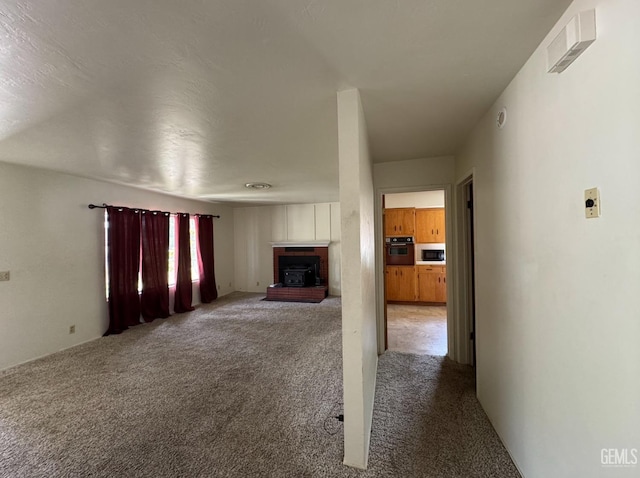 2701 Pinon St, Lake Isabella, CA 93240 - unfurnished living room featuring a fireplace and carpet floors