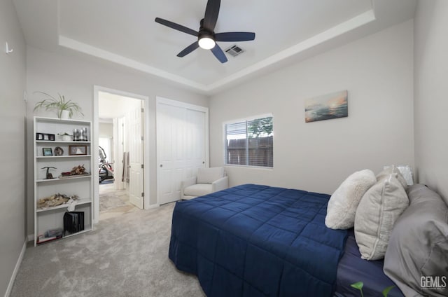 3718 Sycamore Creek Dr, Bakersfield, CA 93313 - bedroom with a tray ceiling, light carpet, a closet, and ceiling fan