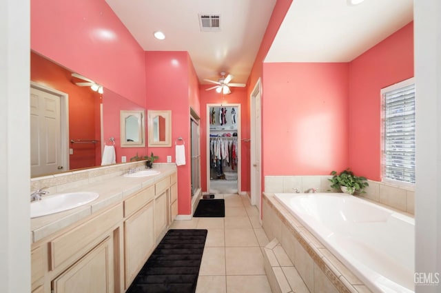 3718 Sycamore Creek Dr, Bakersfield, CA 93313 - full bathroom with a ceiling fan, a garden tub, double vanity, and tile patterned floors