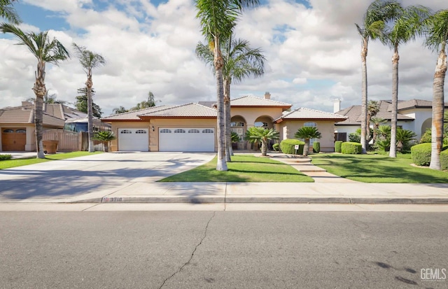3718 Sycamore Creek Dr, Bakersfield, CA 93313 - mediterranean / spanish home featuring concrete driveway, a garage, stucco siding, and a tile roof