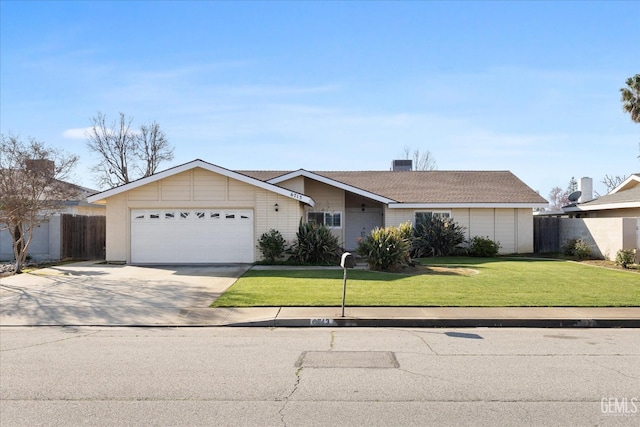 ranch-style house featuring a front lawn and a garage