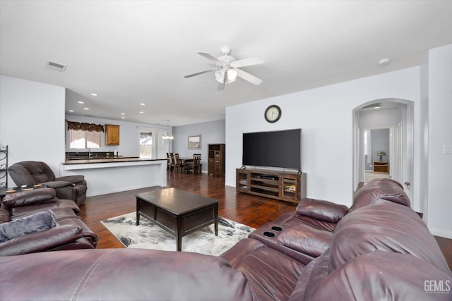 6202 Ocean Jasper Dr, Bakersfield, CA 93313 - living area with a ceiling fan, arched walkways, dark wood-style floors, and recessed lighting