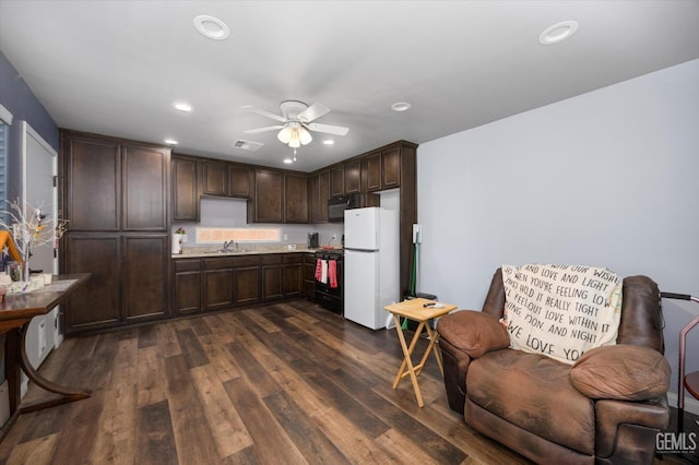 6202 Ocean Jasper Dr, Bakersfield, CA 93313 - kitchen featuring freestanding refrigerator, black range oven, dark brown cabinets, recessed lighting, and ceiling fan