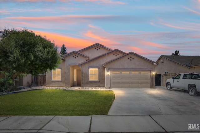 6202 Ocean Jasper Dr, Bakersfield, CA 93313 - mediterranean / spanish house with driveway, an attached garage, and stucco siding