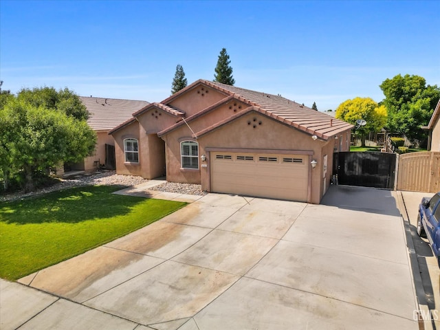 6202 Ocean Jasper Dr, Bakersfield, CA 93313 - mediterranean / spanish-style home with an attached garage, stucco siding, concrete driveway, and a tiled roof