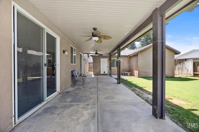 6202 Ocean Jasper Dr, Bakersfield, CA 93313 - fenced backyard with a ceiling fan and a patio