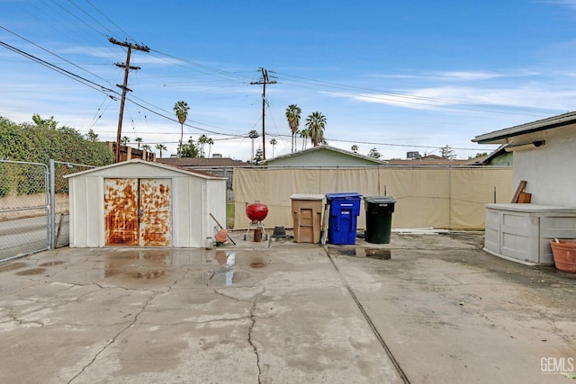 view of shed featuring fence