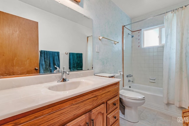 full bathroom with vanity, shower / tub combo, and toilet