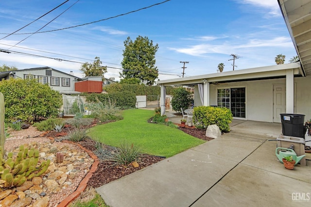 view of yard with a patio area and fence