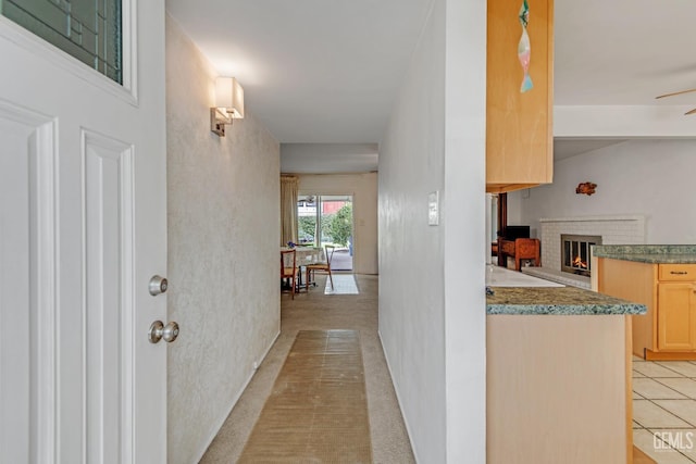 hallway with light colored carpet