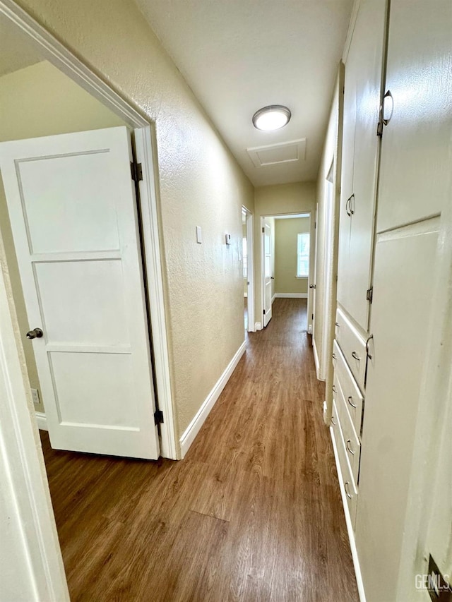 330 Poplar Ave, Bakersfield, CA 93305 - corridor featuring wood finished floors, baseboards, attic access, and a textured wall