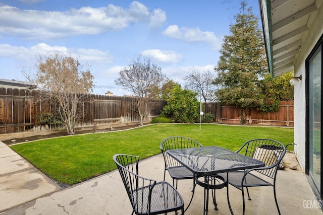 view of patio with a fenced backyard and outdoor dining area