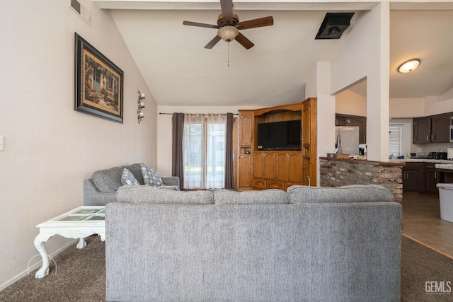 carpeted living room with vaulted ceiling and ceiling fan