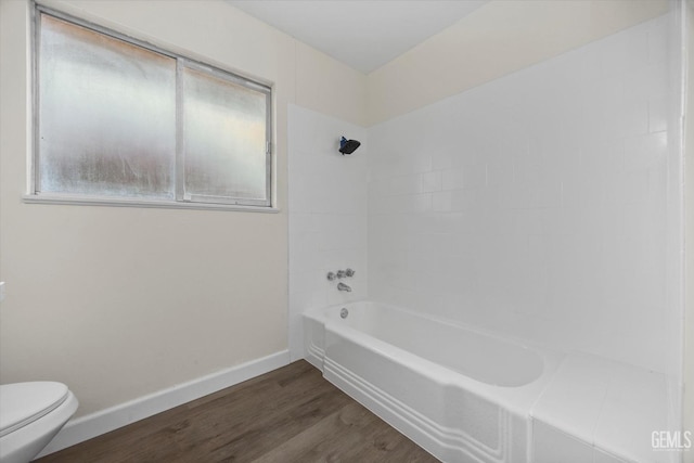 2414 Noble Ave, Bakersfield, CA 93306 - full bath with shower / bathing tub combination, baseboards, wood finished floors, and toilet