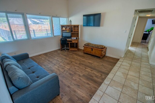 1805 Glenbrea Ct, Bakersfield, CA 93309 - living area with baseboards, wood finished floors, and visible vents