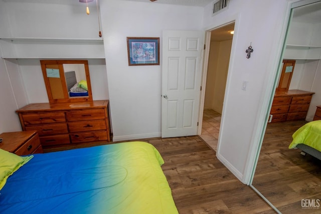 1805 Glenbrea Ct, Bakersfield, CA 93309 - bedroom with baseboards, wood finished floors, visible vents, and a closet