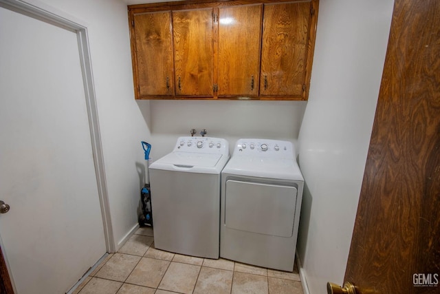 1805 Glenbrea Ct, Bakersfield, CA 93309 - clothes washing area featuring washer and dryer, baseboards, cabinet space, and light tile patterned flooring