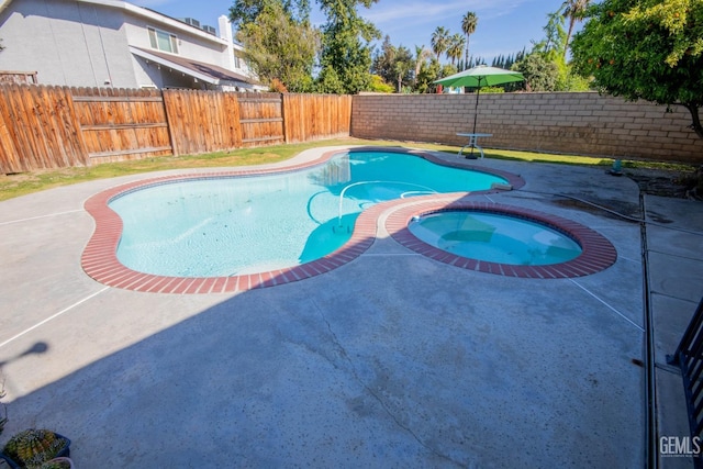 1805 Glenbrea Ct, Bakersfield, CA 93309 - view of swimming pool with a fenced backyard, a patio area, a fenced in pool, and an in ground hot tub