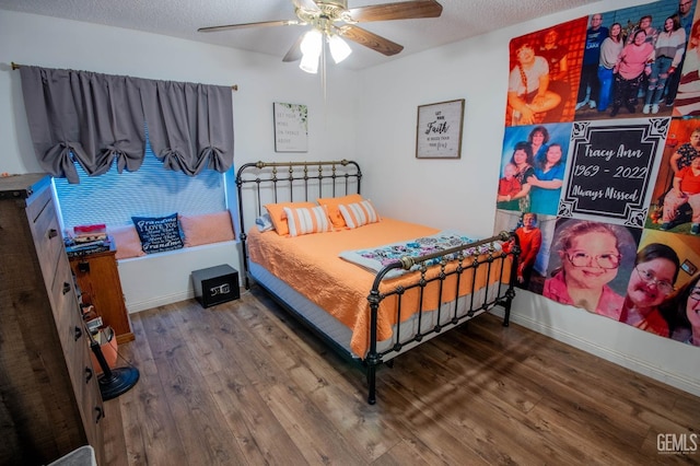 1805 Glenbrea Ct, Bakersfield, CA 93309 - bedroom with baseboards, wood finished floors, a textured ceiling, and ceiling fan