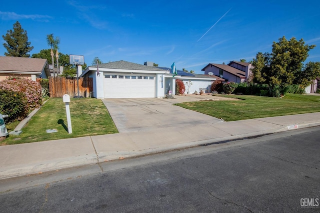 1805 Glenbrea Ct, Bakersfield, CA 93309 - view of front facade with driveway, fence, a garage, roof mounted solar panels, and a front yard