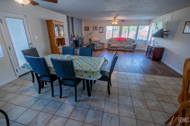 1805 Glenbrea Ct, Bakersfield, CA 93309 - dining area with visible vents, a ceiling fan, light tile patterned floors, baseboards, and a textured ceiling