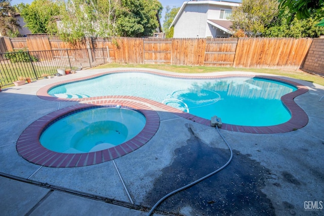 1805 Glenbrea Ct, Bakersfield, CA 93309 - view of swimming pool featuring a fenced in pool, a patio area, a fenced backyard, and an in ground hot tub