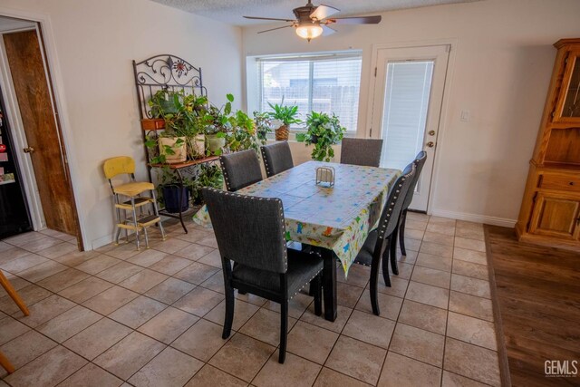 1805 Glenbrea Ct, Bakersfield, CA 93309 - dining room featuring baseboards, a ceiling fan, and light tile patterned floors