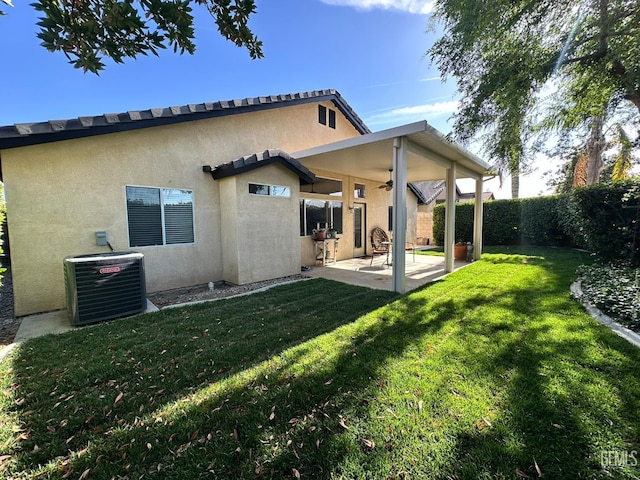 10304 Blythe Ct, Bakersfield, CA 93311 - back of property featuring ceiling fan, central air condition unit, stucco siding, and a patio area