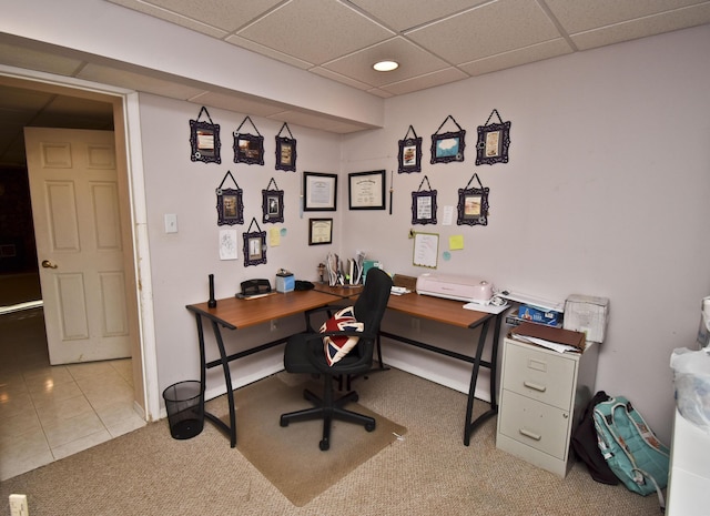 office with light carpet, light tile patterned floors, a paneled ceiling, and baseboards