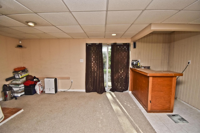 bar featuring a dry bar, a paneled ceiling, and baseboards