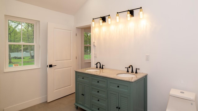 119 N Shore Dr, Albrightsville, PA 18210 - bathroom featuring toilet, vaulted ceiling, baseboards, and double vanity