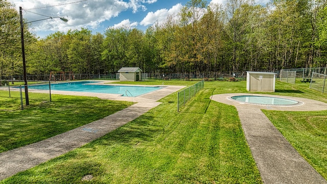 119 N Shore Dr, Albrightsville, PA 18210 - view of swimming pool with a storage unit and an outbuilding