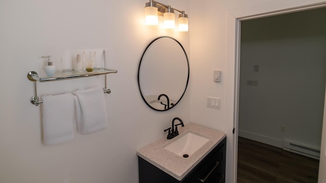 119 N Shore Dr, Albrightsville, PA 18210 - bathroom with a baseboard heating unit, vanity, and wood finished floors