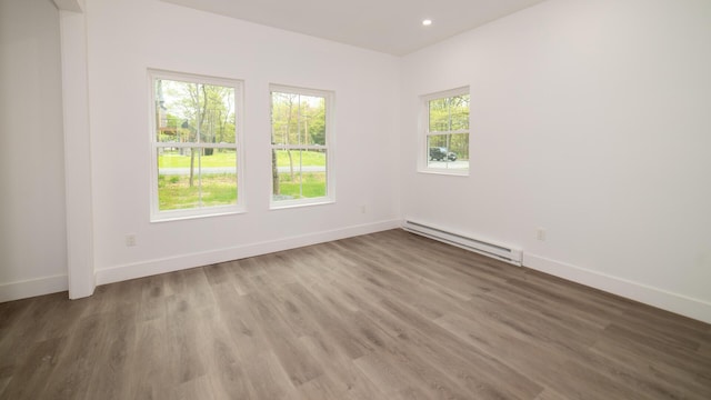 119 N Shore Dr, Albrightsville, PA 18210 - empty room with a baseboard heating unit, baseboards, wood finished floors, and recessed lighting
