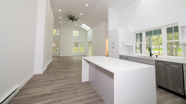119 N Shore Dr, Albrightsville, PA 18210 - kitchen featuring dishwasher, a baseboard heating unit, a sink, recessed lighting, and white cabinetry