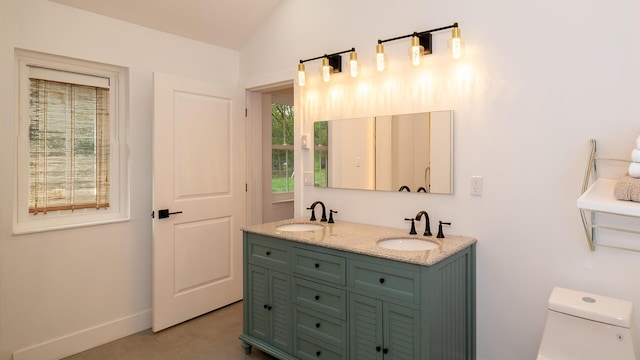 119 N Shore Dr, Albrightsville, PA 18210 - full bath with toilet, double vanity, vaulted ceiling, and baseboards