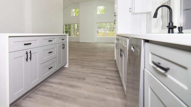 119 N Shore Dr, Albrightsville, PA 18210 - kitchen with dishwasher, baseboards, white cabinets, light wood finished floors, and light countertops
