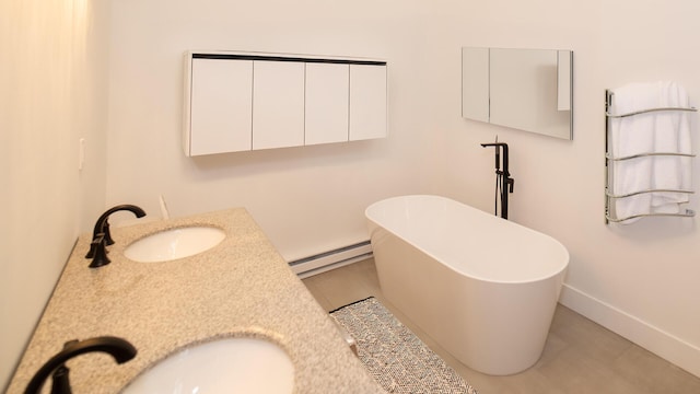 119 N Shore Dr, Albrightsville, PA 18210 - full bathroom with baseboard heating, baseboards, a freestanding tub, and double vanity