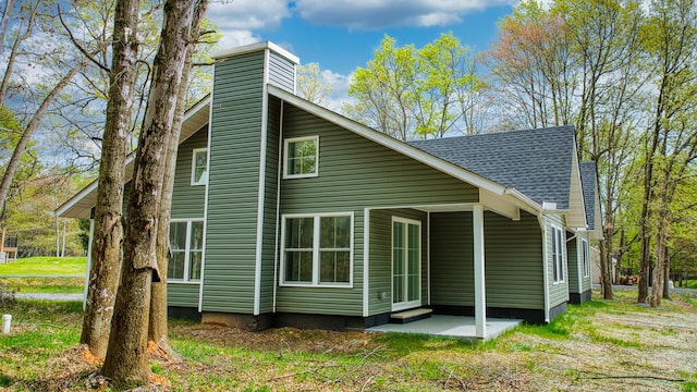 119 N Shore Dr, Albrightsville, PA 18210 - back of property with a chimney, a patio, and a shingled roof