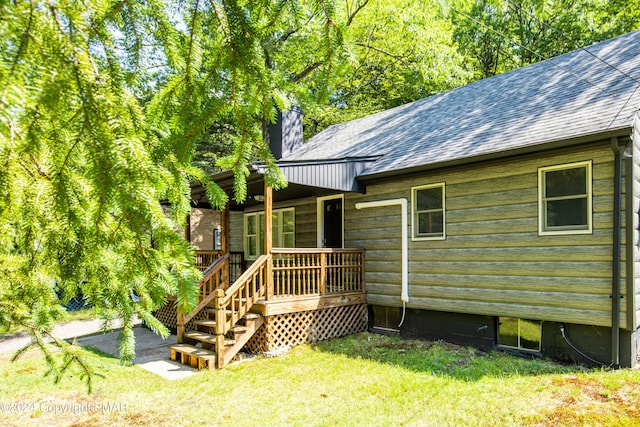 back of house with a lawn