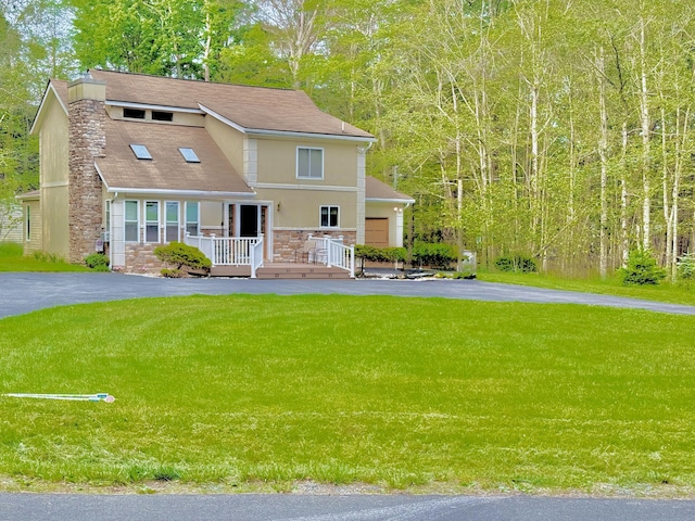 111 Sir Lyonnesse Ct, Pocono Lake, PA 18347 - view of front of home featuring stone siding, a front lawn, driveway, and a chimney